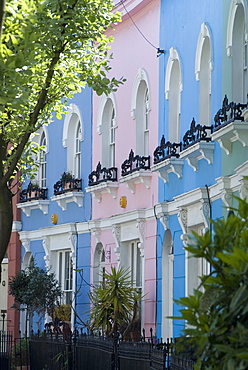 Pastel painted terraced houses, Kelly Street, Kentish Town, London, England, United Kingdom, Europe