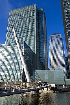 Looking over bridge towards Canary Wharf and towers, Docklands, London, England, United Kingdom, Europe