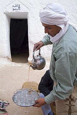 Pouring mint tea in the traditional way, Matmata, Tunisia, North Africa, Africa