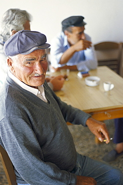 Man in a cafe, Emporio, Santorini (Thira), Cyclades Islands, Greek Islands, Greece, Europe