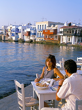 Couple eating at a restaurant, Little Venice, Mykonos Town, Mykonos (Mikonos), Cyclades Islands, Greek Islands, Greece, Europe