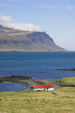 Red roofed farm buildings, Faskrudsfjordur, East area, Iceland, Polar Regions