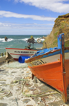 Traditional Portuguese fishing boats in a small coastal harbour, Beja District, west coast, Portugal, Europe