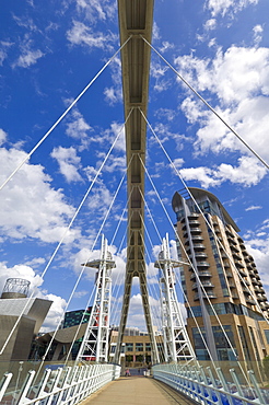 Modern architecture of new apartment buildings and the Lowry Centre fron the Millennium Bridge, Salford Quays, Greater Manchester, England, United Kingdom, Europe