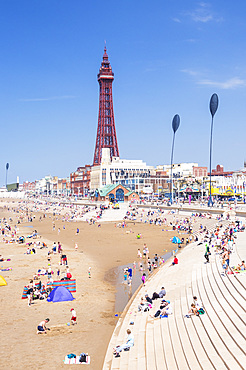 Blackpool Tower, Blackpool beach and seafront promenade with holidaymakers annd tourists, Blackpool, Lancashire, England, United Kingdom, Europe