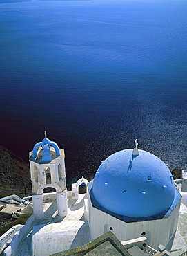 Aerial view over a church perched over sea, Fira Town