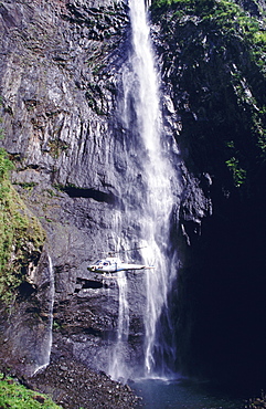 Waterfall and helicopter, Reunion Island, Africa