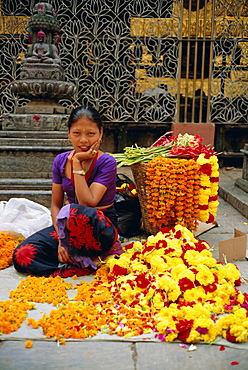 Woman selling flowers, Asan Tole Buddhist temple, Kathmandu, Kathmandu Valley, Nepal, Asia