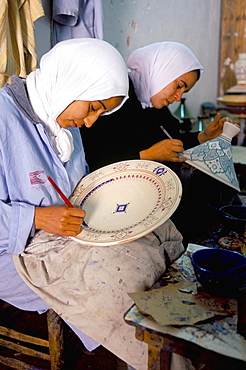 Women painting pottery, potters village of Safi, Atlantic coast, Morocco, North Africa, Africa