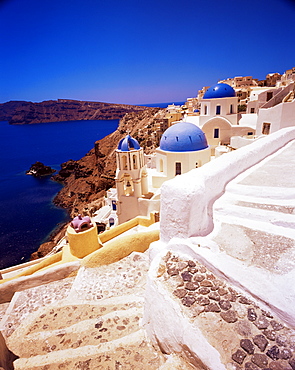 View of churches, staircase and coast, Oia village, island of Santorini (Thira), Cyclades, Greek Islands, Greece, Europe