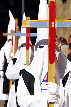 Penitents carrying crosses in procession during Holy Week, Salamanca, Castilla Leon, Spain, Europe