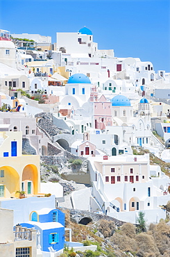 Orthodox churches and stuccoed colorful houses, Oia, Santorini, Cyclades Islands, Greek Islands, Greece, Europe