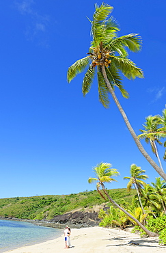 Couple on a tropical beach, Drawaqa Island, Yasawa island group, Fiji, South Pacific islands, Pacific