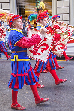 Marching men in costume playing fanfare trumpets during  Scoppio del Carro festival in Florence, Tuscany, Italy, Europe