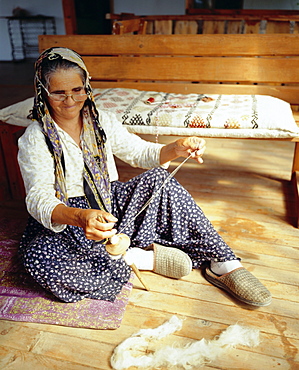 Old Turkish woman sewing a mat, Kekova (Kas), Turkey, Eurasia