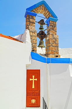 Door and bell tower of Megali Panagia church, Chorio, Symi Island, Dodecanese Islands, Greece