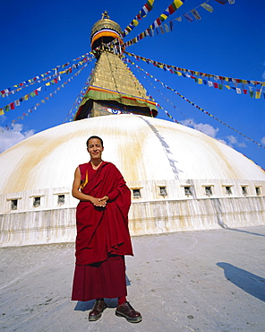 Buddhist Monk in front of Bodnath Stupa, Bodnath, Kathmandu, Nepal, Asia