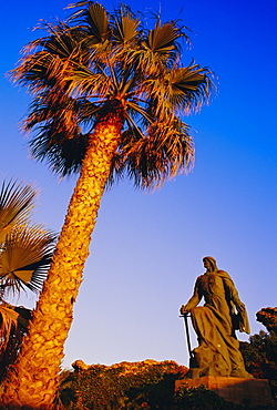 Abdar Rahman I statue and palm tree, Almunecar, Andalusia, Spain