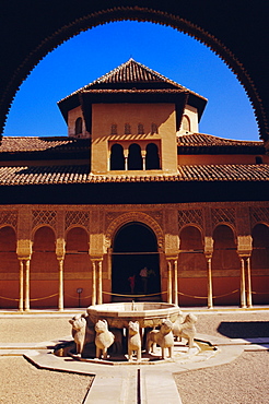 Fountain with 12 stone lions and Patio de los Leones.  Palacio Nazaries, Alhambra, Granada, Andalusia, Spain
