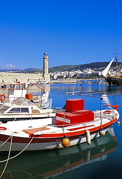 View of old Venetian Rethymo harbour and lighthouse in background, Rethymno (Rethymnon), island of Crete, Greece, Mediterranean, Europe