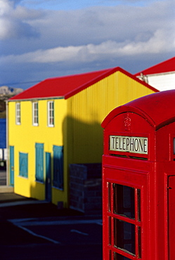 British red telephone box and colourful traditional house, Stanley, East Falkland, Falkland Islands, South Atlantic, South America