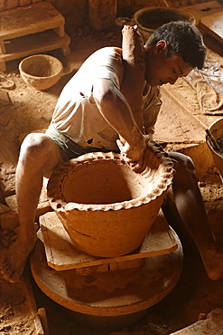 Potter in Nwe Nyein, a pottery town along the Irrawaddy river, Mandalay Division, Republic of the Union of Myanmar (Burma), Asia 