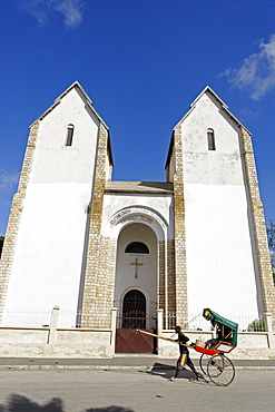 Rickshaw passing Lutheran Church, Toliara (Tulear), capital of the Atsimo-Andrefana region, Madagascar, Africa 