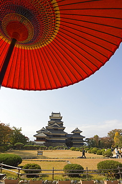 Matsumoto Castle under red parasol, Nagano prefecture, Kyoto, Japan, Asia