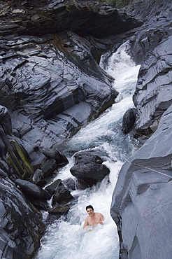 Man enjoying natural hot river water of Tona hotspring bath resort, Maolin, Kaoshiung County, Taiwan, Asia