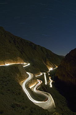 car light trails at night, winding curved mountain road, Dades, Gorge,  Morocco, North Africa