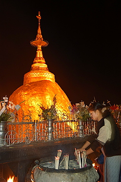 Pilgrims praying at the Golden Rock,The Golden Rock, Kyaiktiyo, Myanmar (Burma), Asia