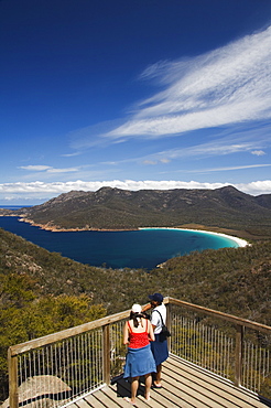 Tourists admiring the view of Wineglass Bay, Coles Bay, Freycinet Peninsula, Freycinet National Park,Tasmania, Australia, Pacific