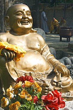 A golden Buddha statue at Shaolin Temple, birthplace of Kung Fu martial arts, Shaolin, Henan Province, China, Asia