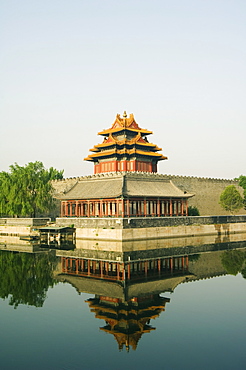 A reflection of the Palace Wall Tower in the moat of The Forbidden City Palace Museum, UNESCO World Heritage Site, Beijing, China, Asia