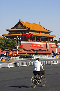 A cyclist near the Gate of Heavenly Peace at the Forbidden City Palace Museum, Beijing, China, Asia