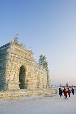 Tourists walking past the snow and Ice Sculptures at the Ice Lantern Festival, Harbin, Heilongjiang Province, Northeast China, China, Asia