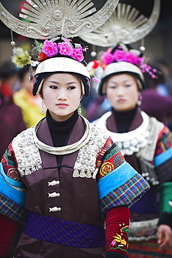 Women in ethnic costume at a Lunar New Year festival in the Miao village of Qingman, Guizhou Province, China, Asia