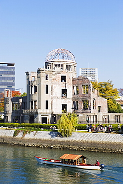 Atomic Bomb Dome, UNESCO World Heritage Site, and boat on Aioi river, Hiroshima, Hiroshima prefecture, Japan, Asia