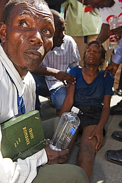 Girl being exorcised in Voodoo ritual, memorial day celebration one month after the January 2010 earthquake, Port au Prince, Haiti, West Indies, Caribbean, Central America