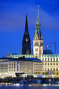 City illuminated at night on Lake Binnenalster, Hamburg, Germany, Europe