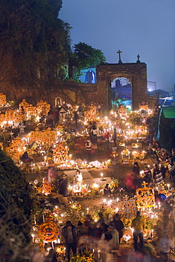 A candle lit cemetery, Dia de Muertos (Day of the Dead) festival in a cemetery on Isla Janitzio, Lago de Patzcuaro, Michoacan state, Mexico, North America