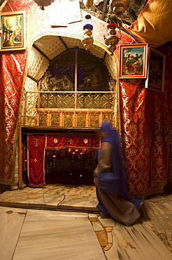 Nun inside the Church of the Nativity (birth place of Jesus Christ), Bethlehem, Israel, Middle East