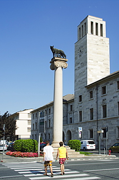 Statue of a wolf and clock tower, Aosta, Aosta Valley, Italy, Europe