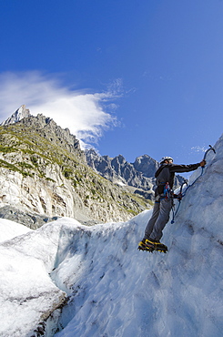 Ice climber at Mer de Glace glacier, Chamonix, Haute-Savoie, French Alps, France, Europe 