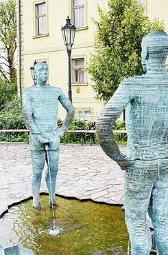 Pissing Men statue by David Cerny, Franz Kafka Museum, Prague, Czech Republic, Europe