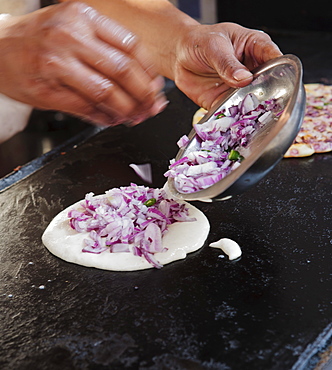 Street vendor making paratha naan with red onion, Rishikesh, Uttar Pradesh, India, Asia