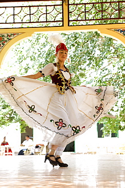 An Uyghur dancer performing dance in Abakh Hoja Tomb, Kashgar, Xinjiang Uyghur autonomy district, Silkroad, China