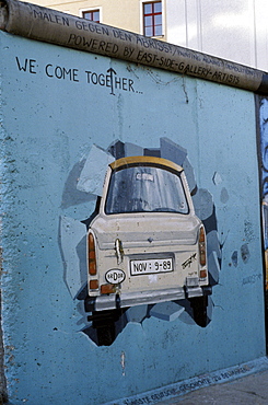 A Trabant car painted on a section of the Berlin Wall near Potsdamer Platz, Mitte, Berlin, Germany, Europe