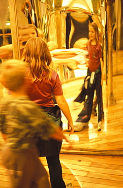 Children standing in front of distorting mirrors, in Bludiste (Maze), Petrin Gardens, Prague, Czech Republic, Europe