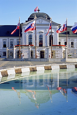 Rococo Grassalkovich Palace dating from the 1760s, and reflection in fountain, Bratislava, Slovakia, Europe